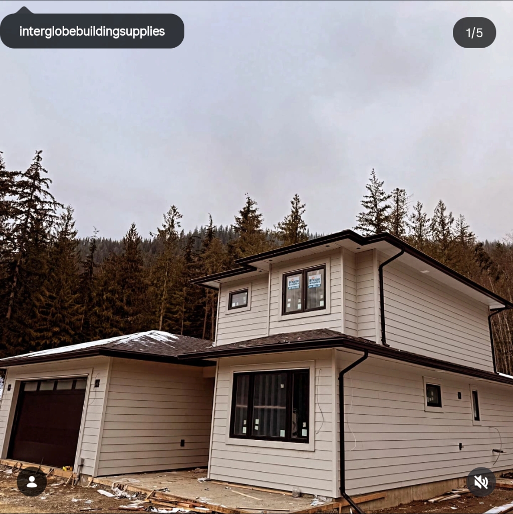 Mountain-side home with fresh siding and gutters