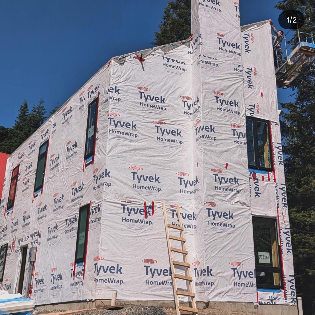 House wrapped in weather barrier before siding